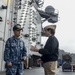 Navy Chief of Chaplains, Rear Adm. Margaret G. Kibben, speaks with Cmdr. David S. Yang On the Flight Deck of the USS Ronald Reagan