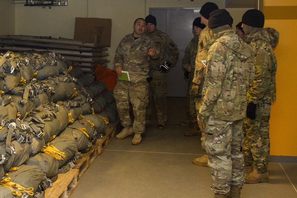 Parachute riggers establish readiness one parachute at a time