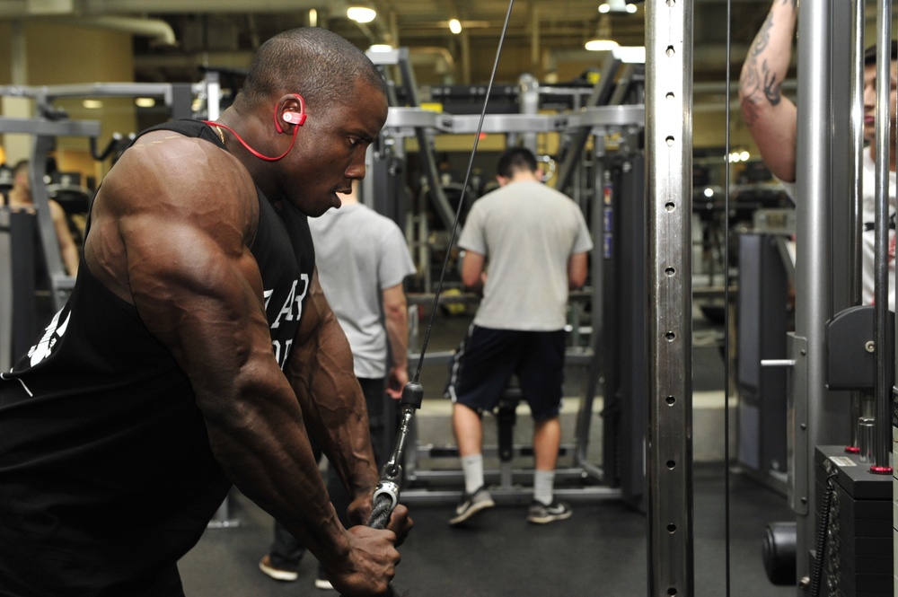 Airman performs tricep rope pulldown