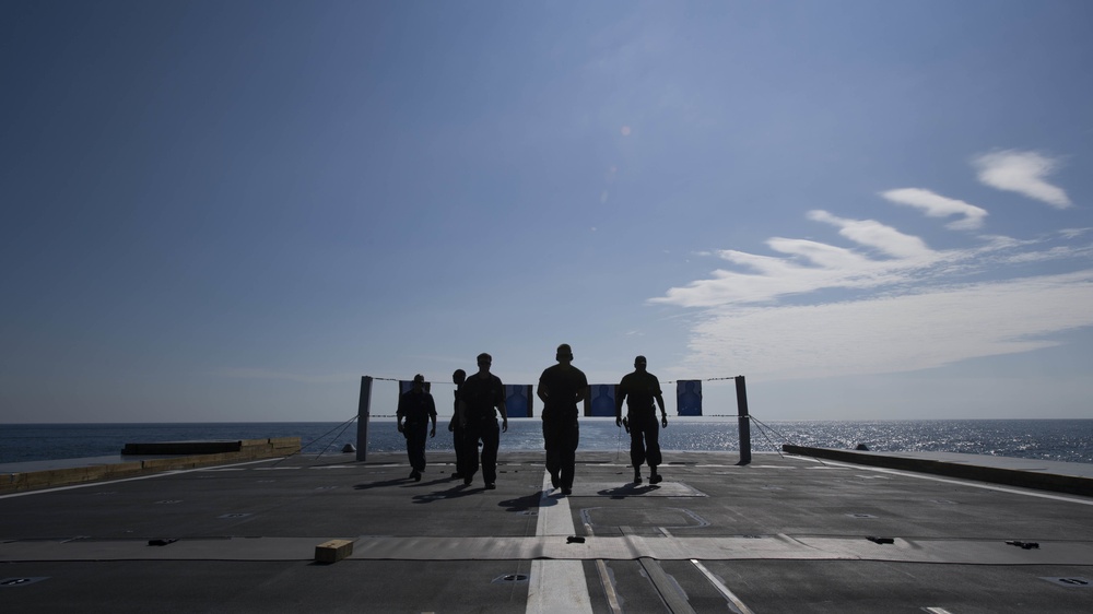 USS Zumwalt Sailors participate in small arms qualification test