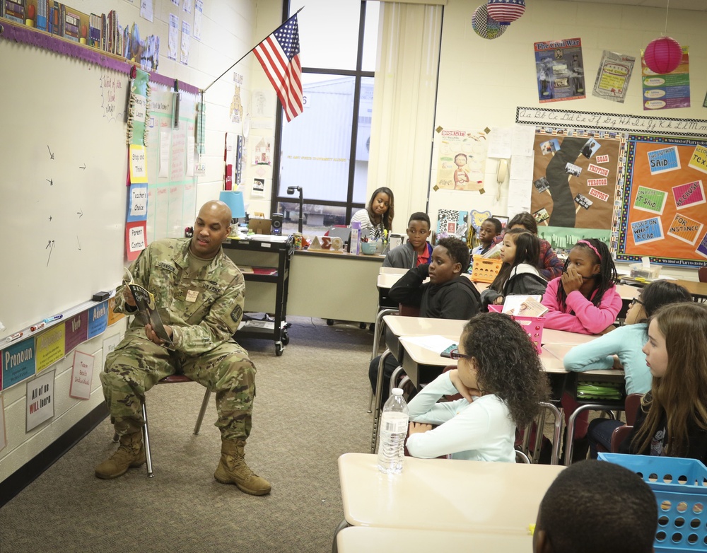Signal Officer volunteers to read to children