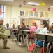 Signal officer volunteers to read to children