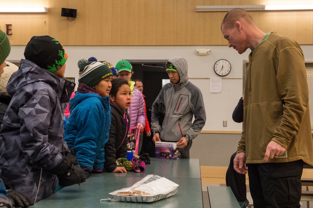 Toys for Tots Marines travel across the Northwest Arctic Borough to deliver holdiay gifts