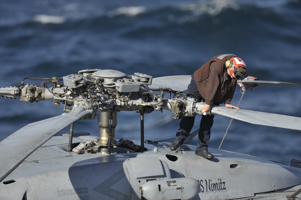 Sailor performs maintenance