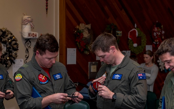 Members of the Royal Australian Air Force graduate from the EA-18G Growler pilot and electronic warfare officer pilot exchange program.