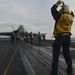 Sailors prepare to launch an F/A-18F