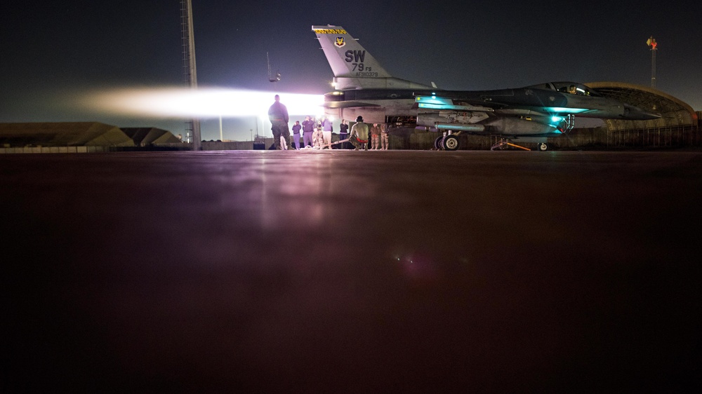 F-16 operations inspection lights up night