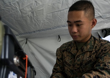 Postal Marines perform field training exercise on Camp Hansen