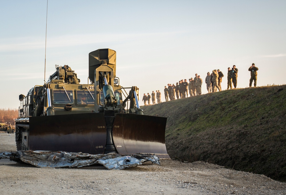 Armored bulldozer removes roadblocks