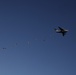 Paratroopers descending from aircraft