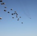 Paratroopers descending from aircraft