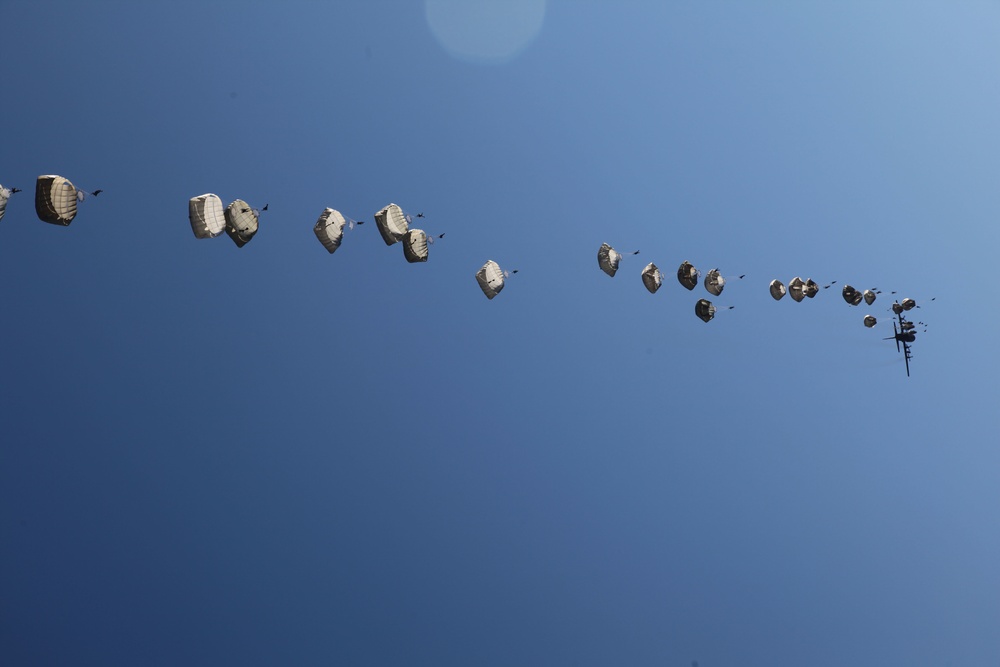 Paratroopers descending from aircraft