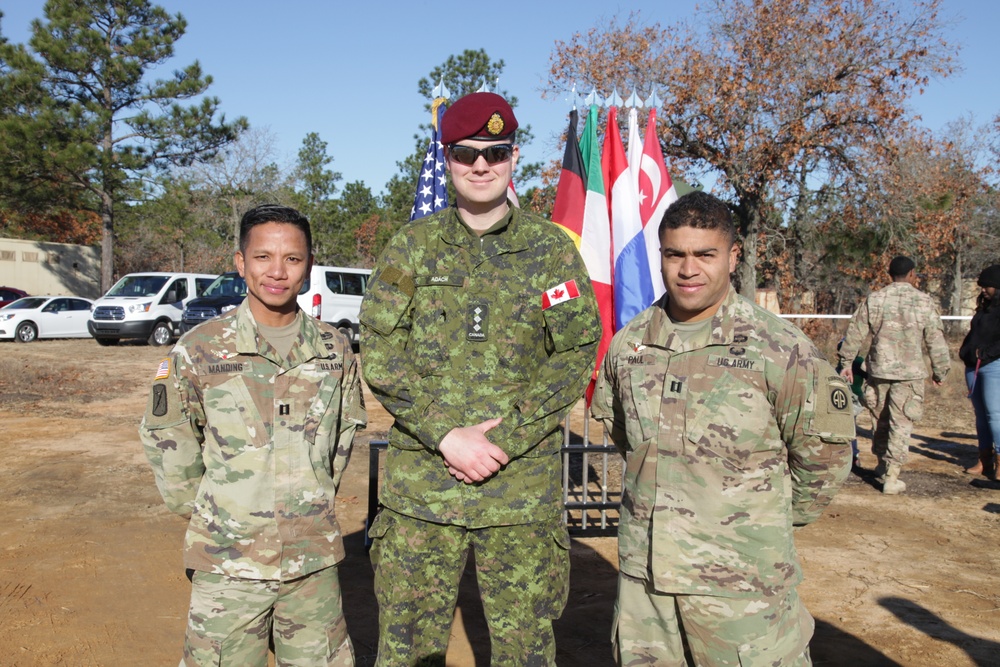 Paratroopers poses with Canadian Jump master