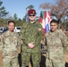Paratroopers poses with Canadian Jump master