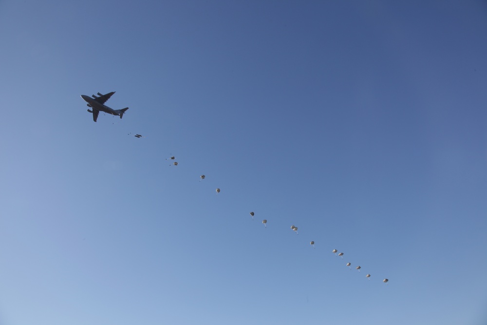 Paratroopers descending from aircraft