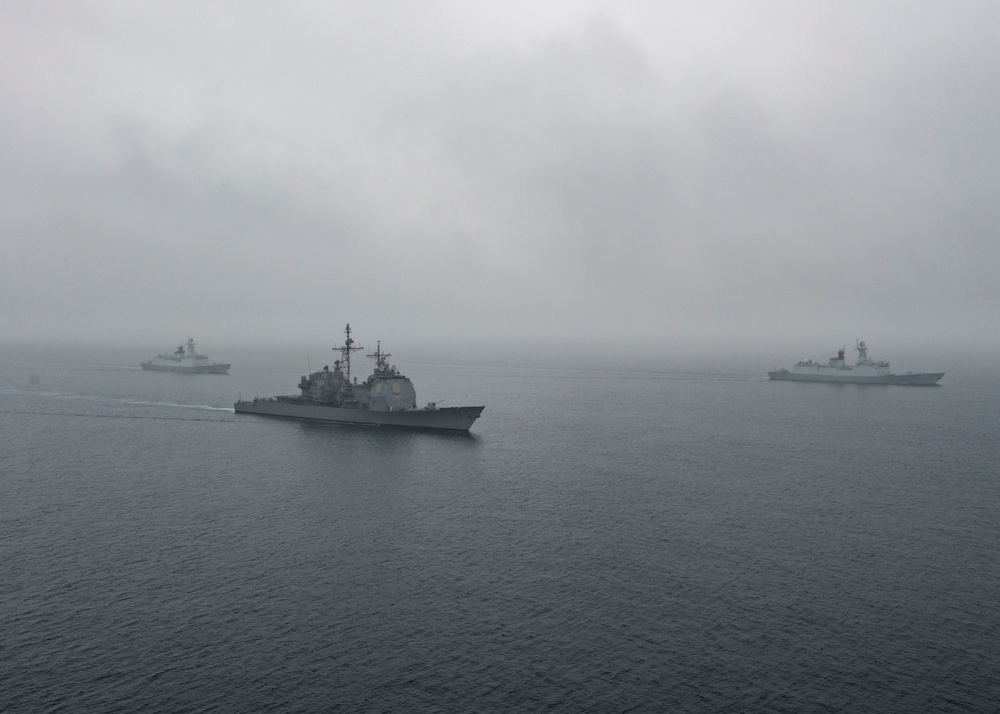 USS Bunker Hill Participates In Maneuvering Exercise With Chinese Ships