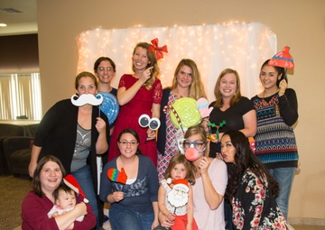 Military spouses exhange cookies and ornaments