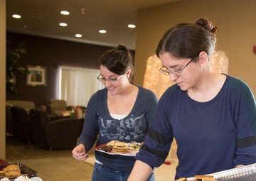 Military spouses exhange cookies and ornaments