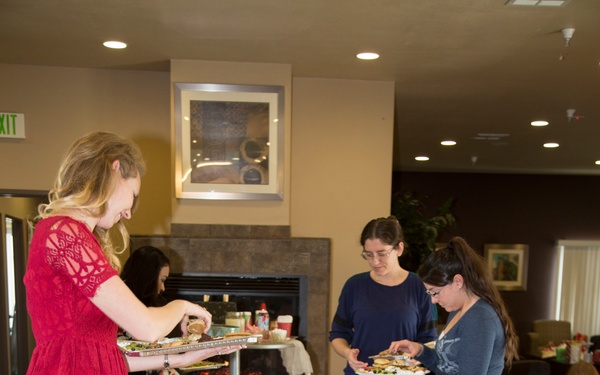 Military spouses exhange cookies and ornaments
