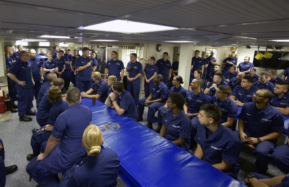 Vice Admiral Karl L. Schultz speaks to the Coast Guard Cutter Hamilton crew