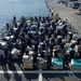 Coast Guard Cutter Hamilton crew stand next to 26.5 tons of cocaine