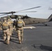Paratroopers prepare to load UH-60 Black Hawk