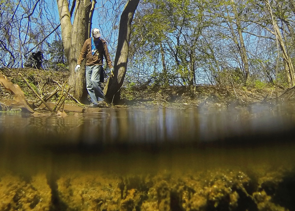 Hanscom volunteers remove trash from river