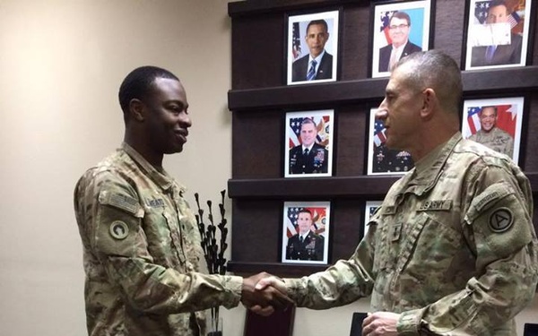 1st TSC Soldier Coined for Deployment Achievements