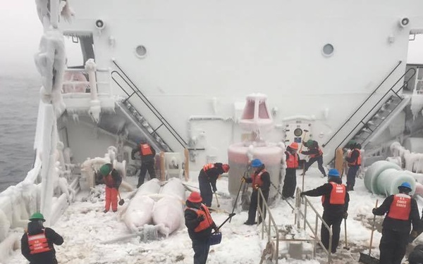 Crew of CGC Alder clears ice from deck