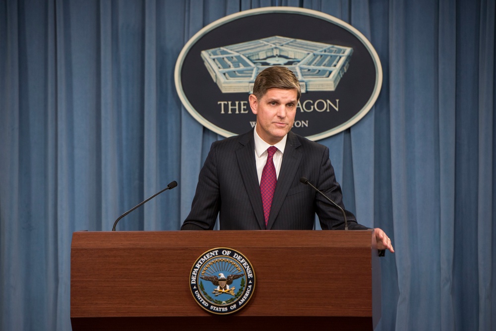 Peter Cook briefs reporters