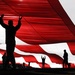 Nellis, Creech Airmen raise American Flag during Las Vegas Bowl