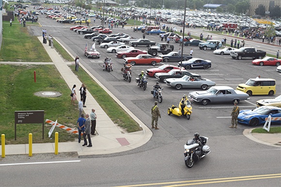 Military, private and commercial vehicles cruise the Detroit Arsenal