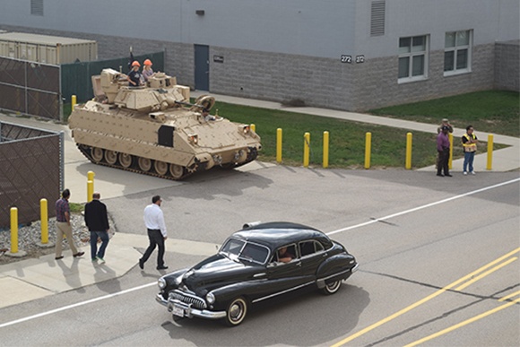 Military, private and commercial vehicles cruise the Detroit Arsenal