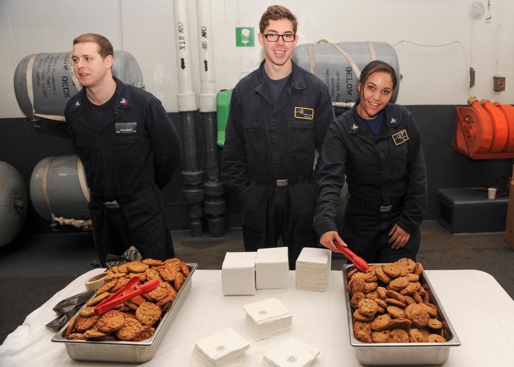 Nimitz Sailors serve cookies