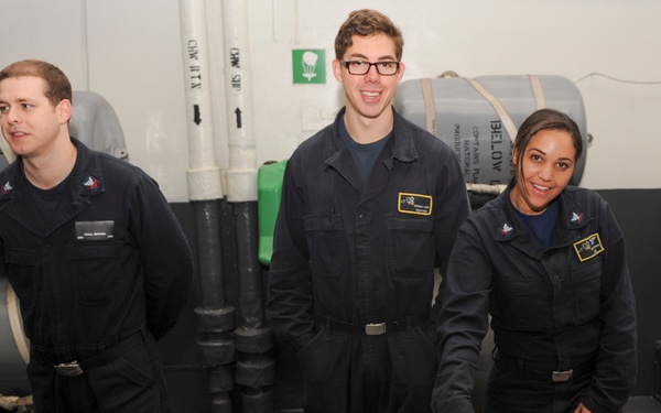 Nimitz Sailors serve cookies
