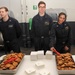 Nimitz Sailors serve cookies