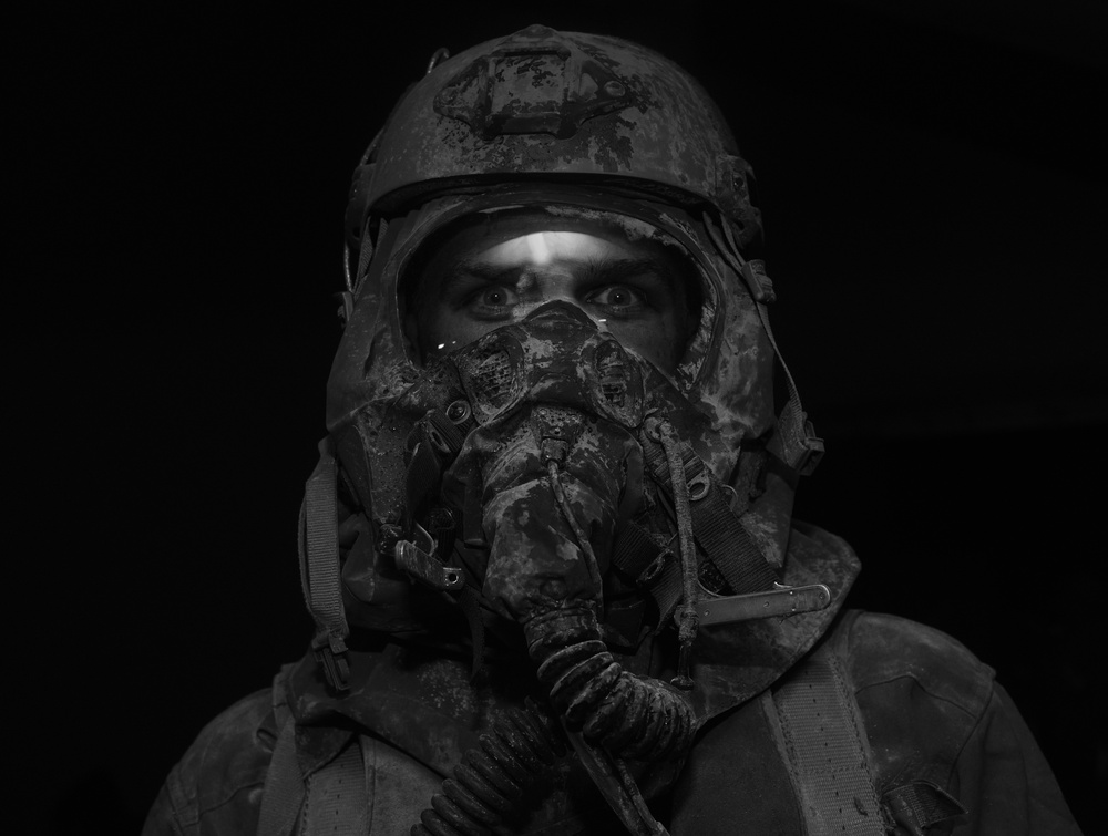 Aircrew member processes decontamination line