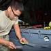 Maintenance Airmen patch up the dings and scratches