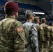 Soldiers stand at attention during National Anthem