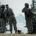 Army Reserve soldiers check downrange for obstructions while Mount Rainier looms in the background