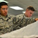 AFE Airmen inspect parachutes