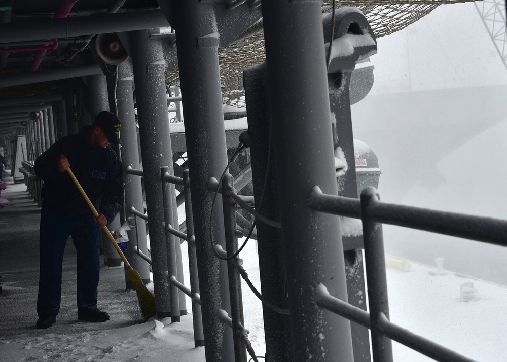 snow falls onboard the USS Bataan (LHD 5)