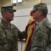Maj. Gen. Glenn H. Curtis, the adjutant general of the Louisiana National Guard, receives the official colors from outgoing commander Lt. Col. Geoffrey M. Allen.