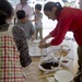 Marines experience a mochi-making ceremony in Uruma City