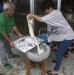 Marines experience a mochi-making ceremony in Uruma City