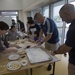 Marines experience a mochi-making ceremony in Uruma City