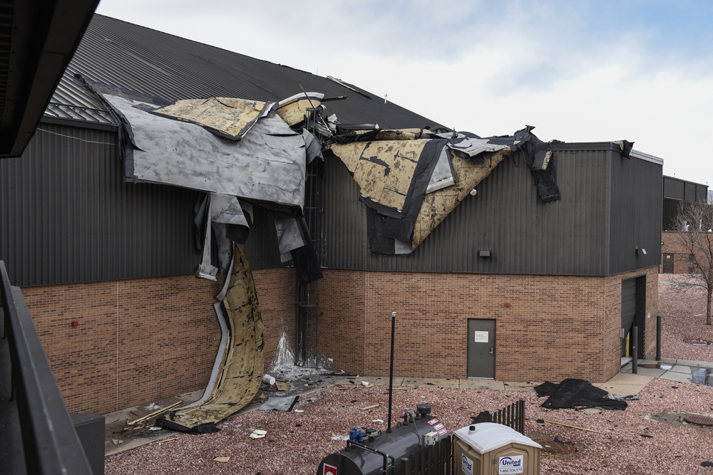 Wind causes building, vehicle damage