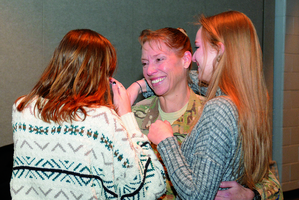 Army mom returning from deployment surprises daughters at school