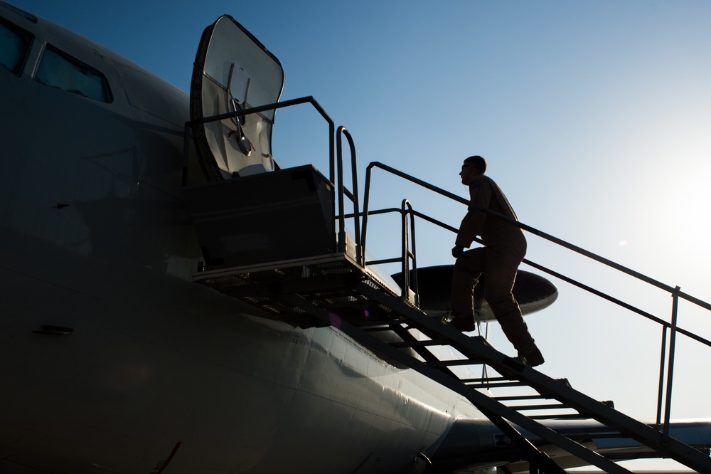 Under heavy fog, deployed maintainers repair aircraft engine in support of CJTF-OIR