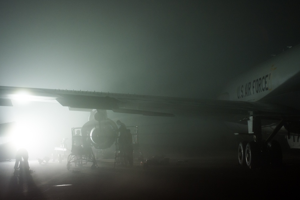 Under heavy fog, deployed maintainers repair aircraft engine in support of CJTF-OIR